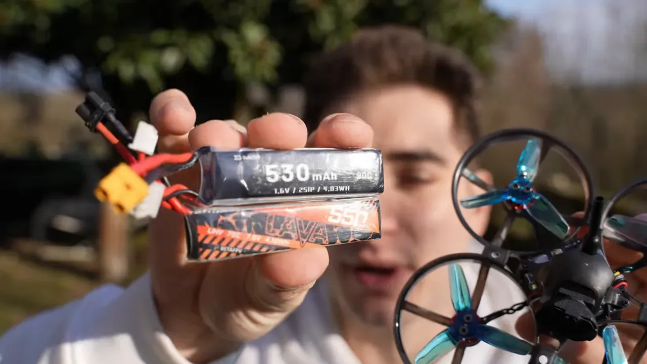 Close-up of two battery packs with readable labels showing 