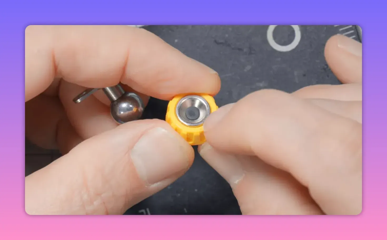 Close-up of a yellow base showing the exposed metal conductive ring inside the insert