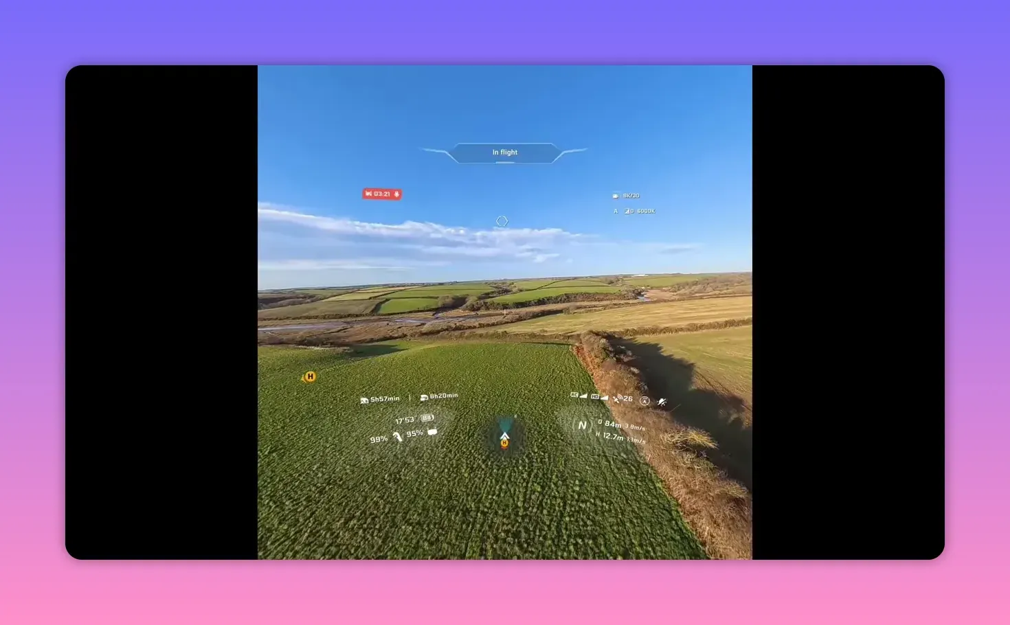Crisp FPV goggles view of the Anti-Gravity A1 with 'In flight' HUD and telemetry visible over countryside