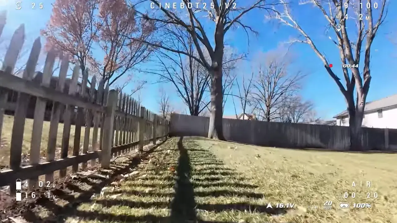 Cinebot25 V2 in-flight DVR showing battery voltage 16.1V, flight time 00:20 and telemetry during a fence-line pass