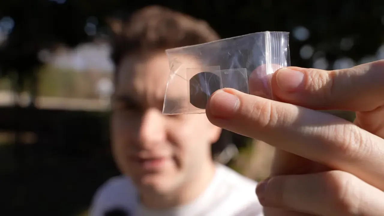 close-up view of the Mobula 8 ND filter in a zip bag held by hand