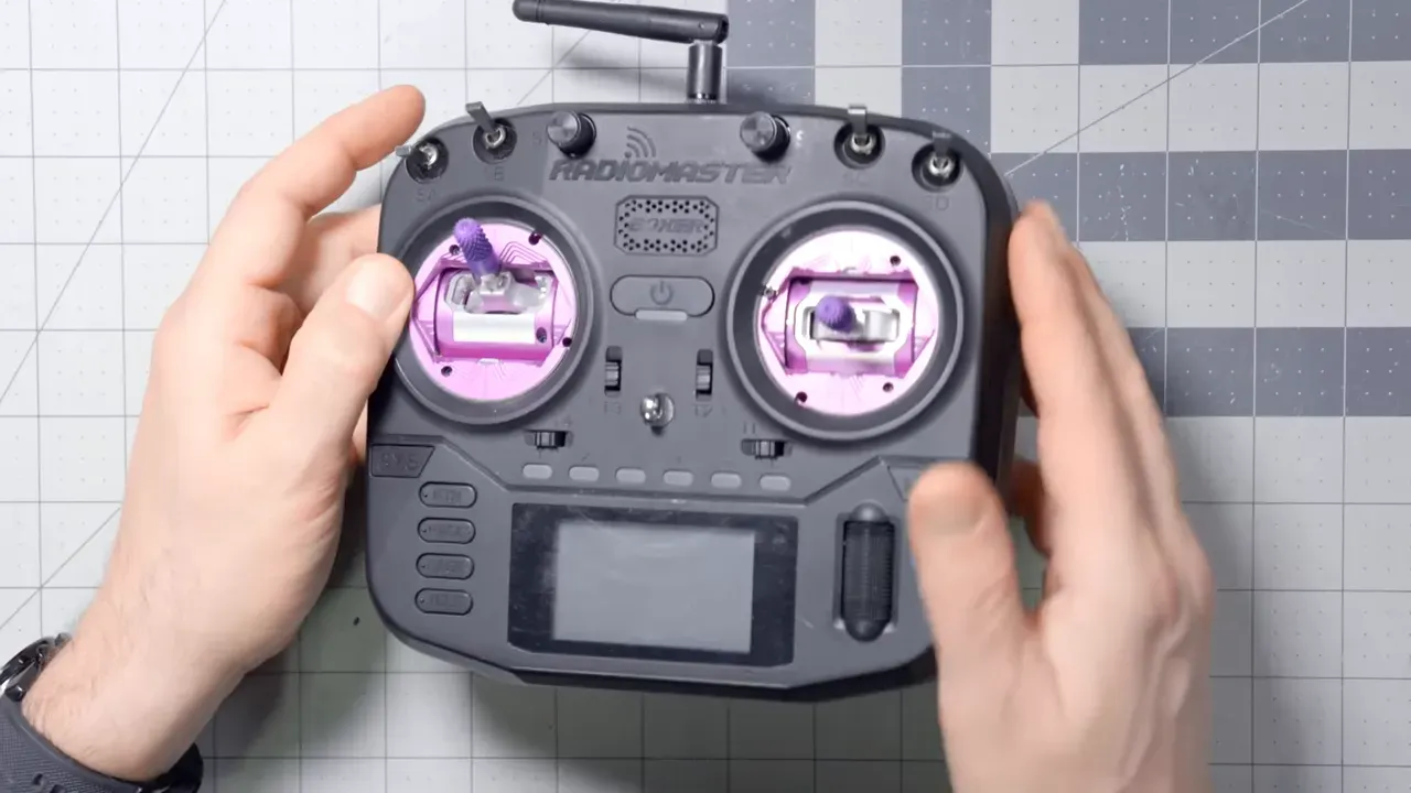Radiomaster Boxer top-down view showing purple gimbal plates, switches and antenna