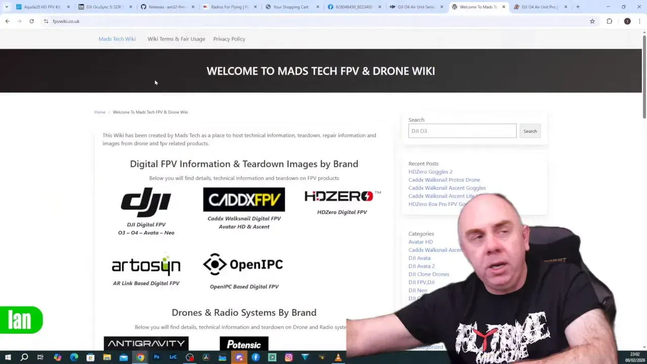 Screenshot of the 'Welcome to Mads Tech FPV & Drone Wiki' page with the presenter inset at the lower-right — useful for checking PCB photos and production dates