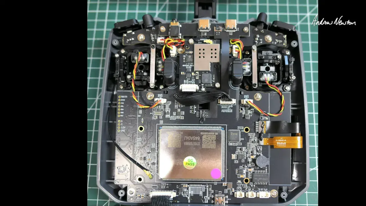 Radiomaster AX12 internal mainboard with visible wiring and onboard components