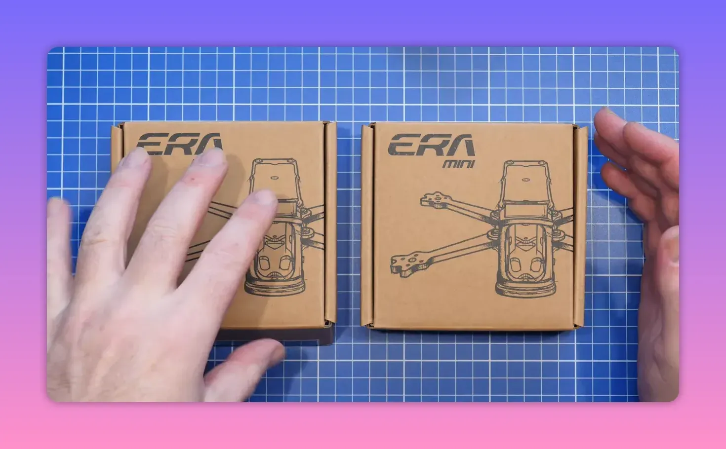 FpV ERA Mini kit boxes with hands on blue cutting mat