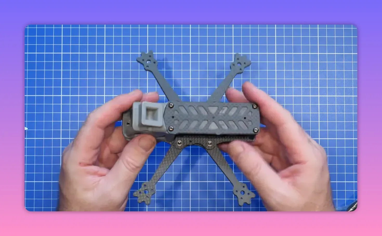 ERA Mini frame front end held in hands above a blue cutting mat