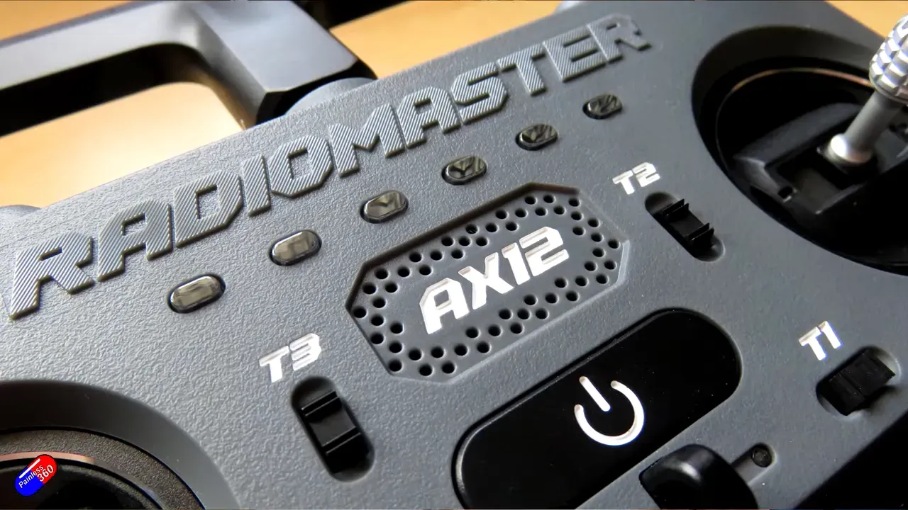 RadioMaster AX12 front panel with embossed Radiomaster logo, AX12 speaker badge, power button and control switches