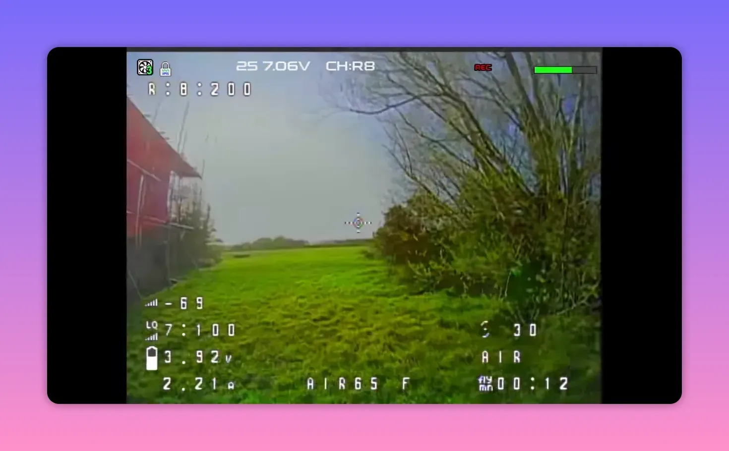 Analogue FPV HUD view of the BetaFPV Air65 II flying on channel R8 over grass with REC overlay