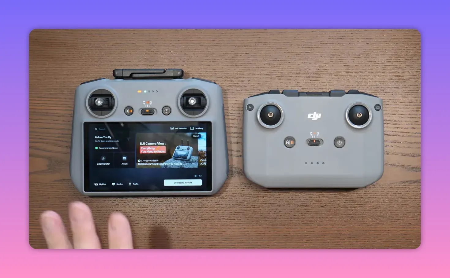 DJI RC2 controller with screen on showing DJI Camera View interface next to another controller