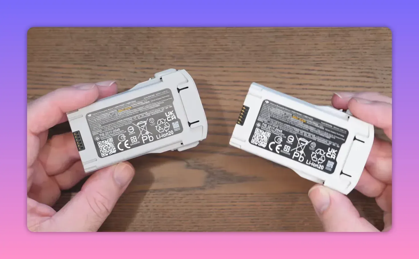 DJI Lito X1 battery packs held side by side showing the front labels and charging contact area