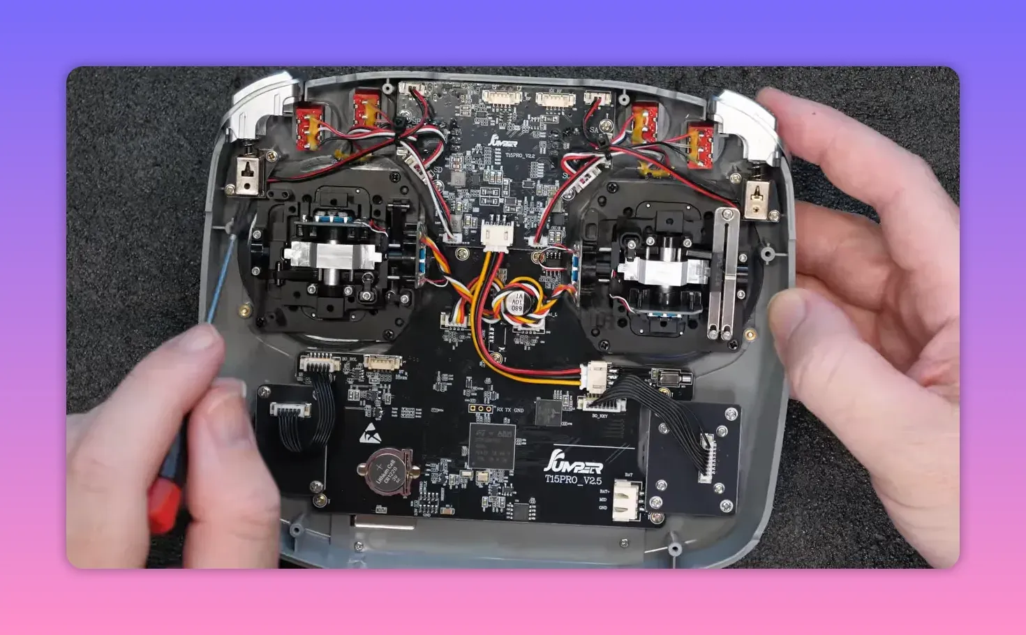 Jumper T15 Pro transmitter internals with visible wiring and main PCB boards