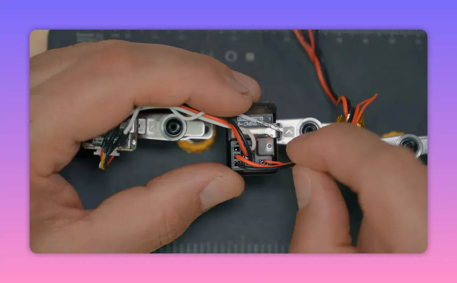 Close-up of ExpressLRS receiver wiring with GPS TX connected to the Serial RX pin area