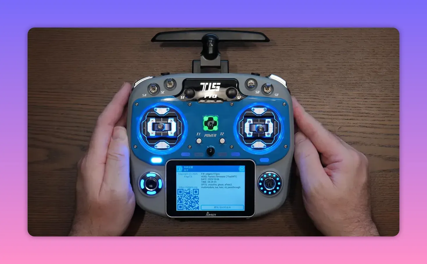 Jumper T15 Pro transmitter front view with touchscreen showing firmware details