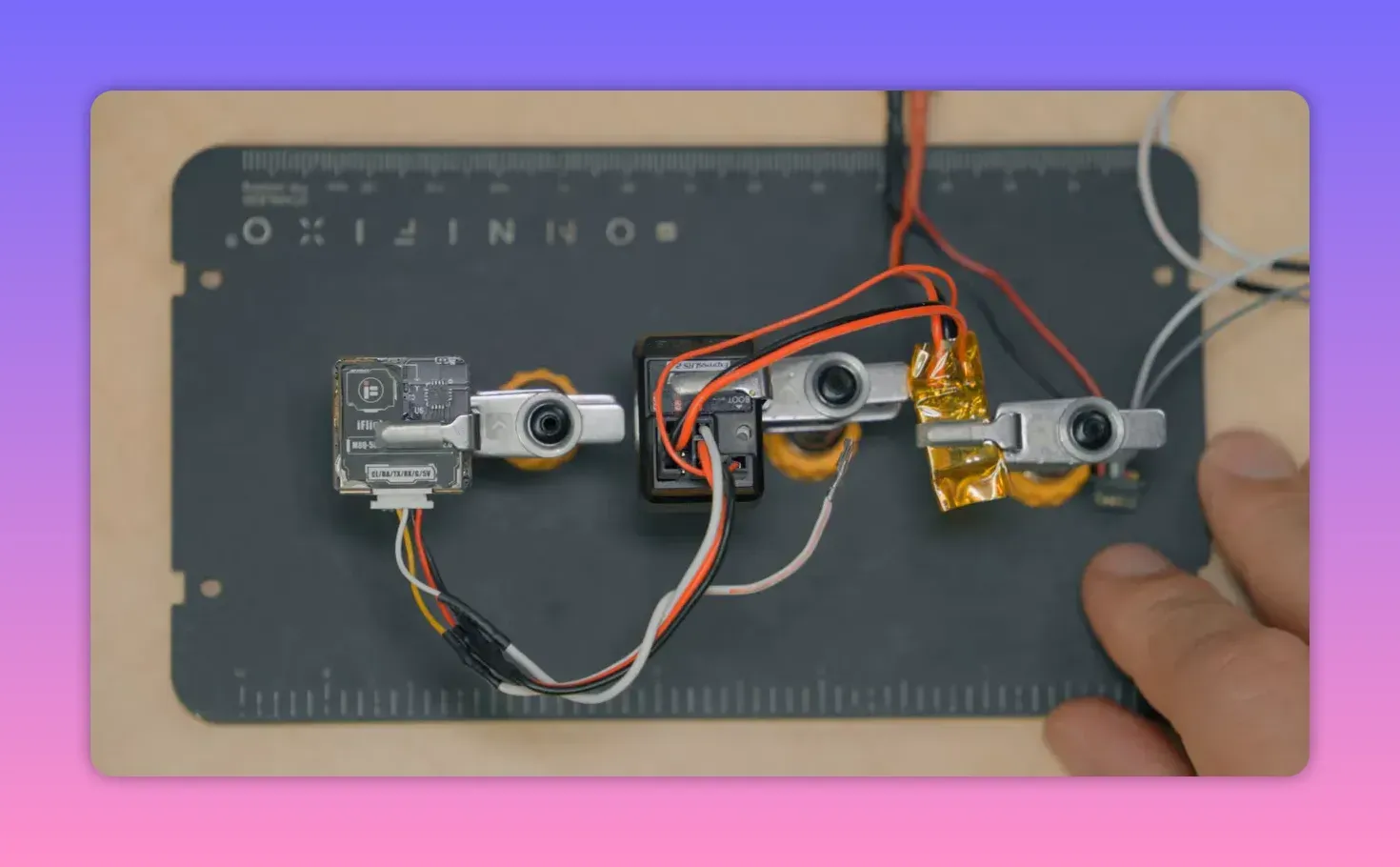 Close-up of ExpressLRS receiver board wiring showing GPS connections