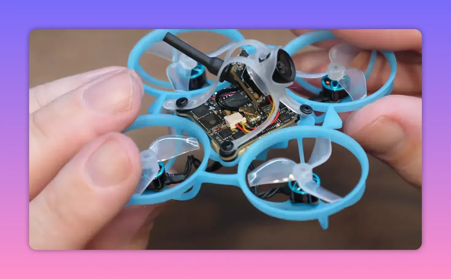 BetaFPV Air65 II freestyle 1S whoop close-up showing onboard camera and 5-in-1 electronics layout inside the frame