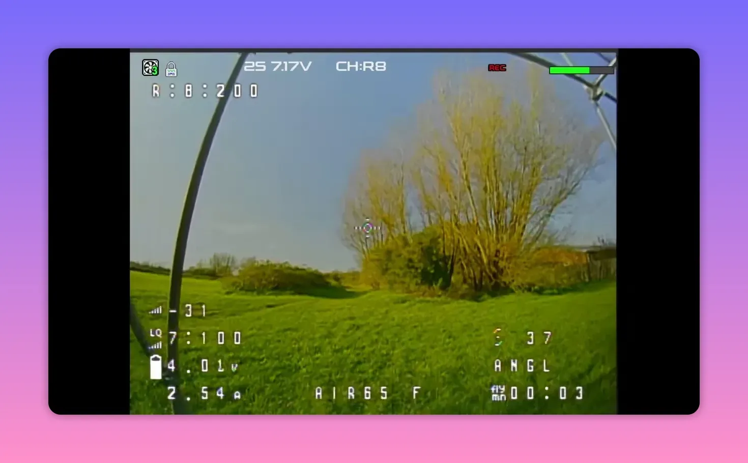 Analogue FPV HUD feed showing BetaFPV Air65 II freestyle on CH R8 over a grassy yard with REC overlay and ANGLE mode indicator