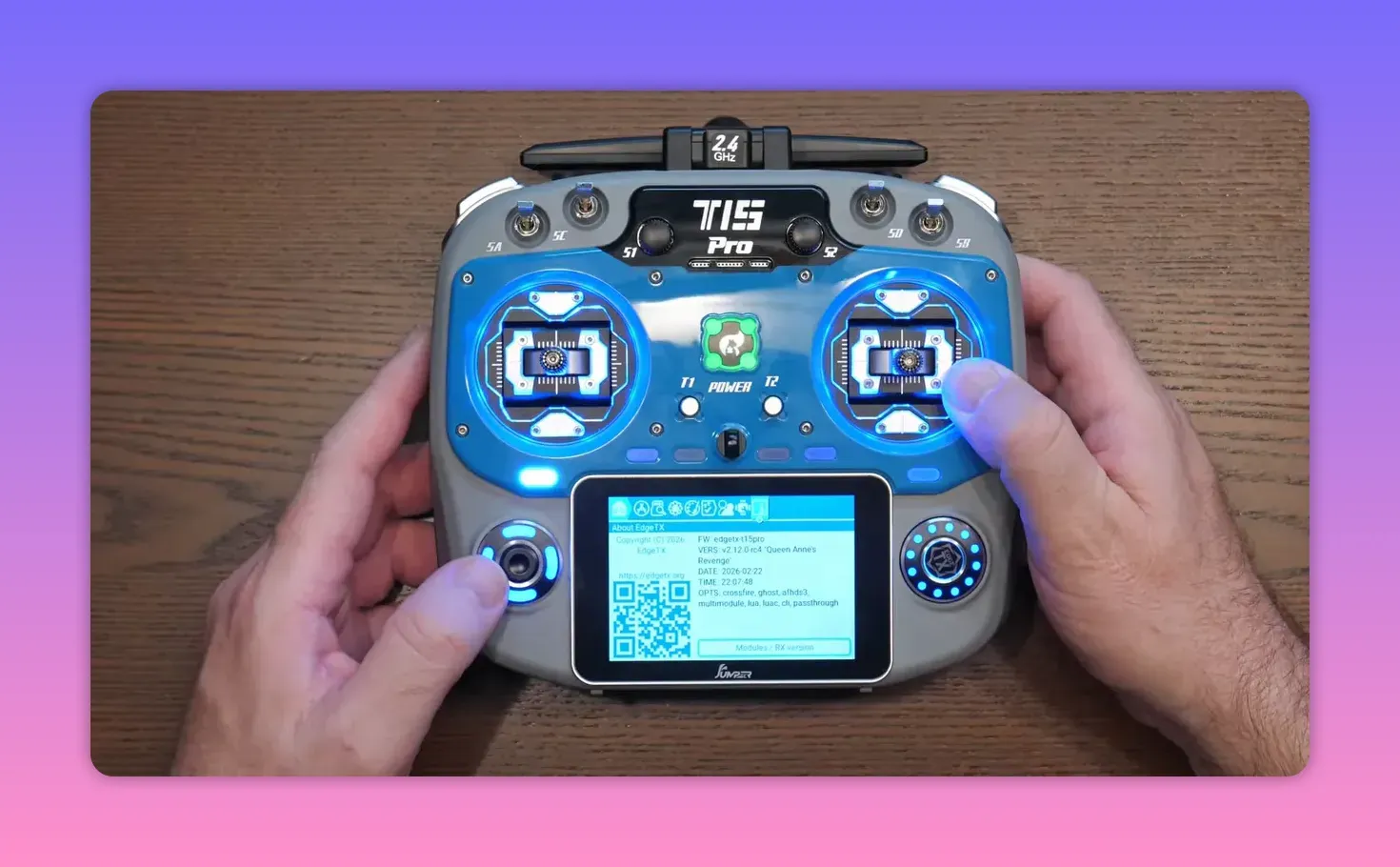 Jumper T15 Pro transmitter with illuminated buttons and touchscreen showing EdgeTX DFU firmware information