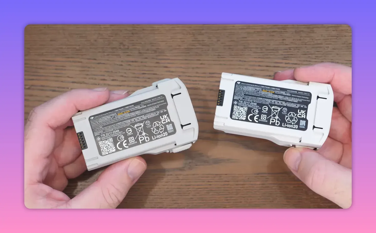 Presenter holding the DJI Lito X1 drone in a studio setup near the Fly More box