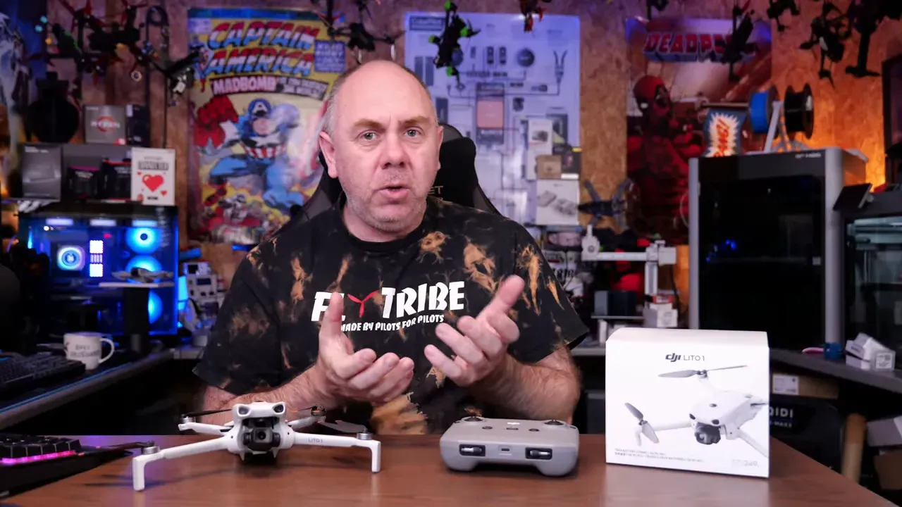 Reviewer pointing toward DJI Lito 1 drone and controller box during final verdict