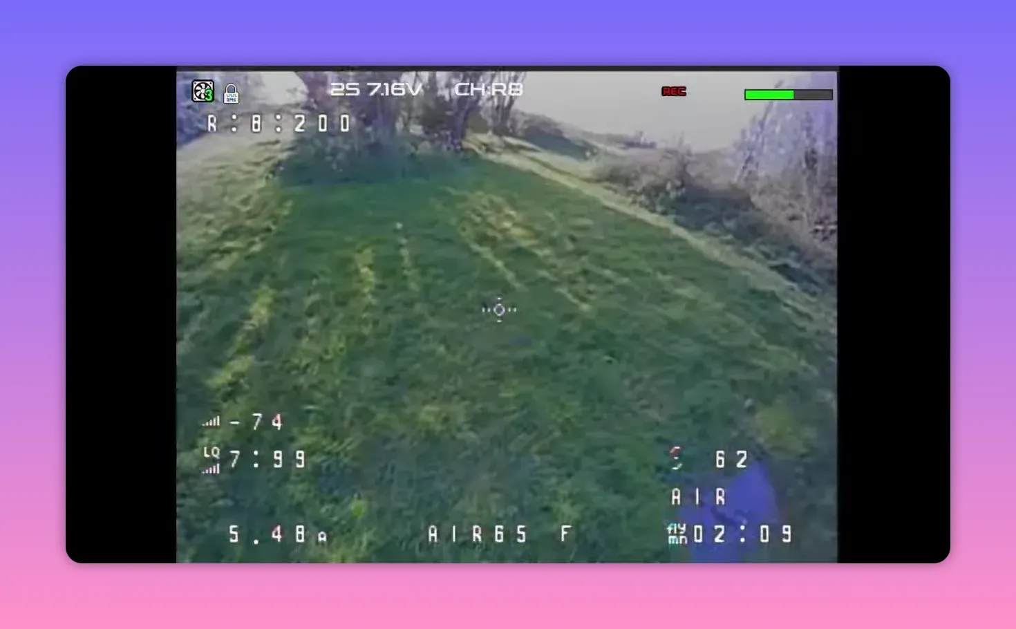 Analogue FPV HUD recording from the BetaFPV Air65 II showing CH R8 and REC status over a grassy slope