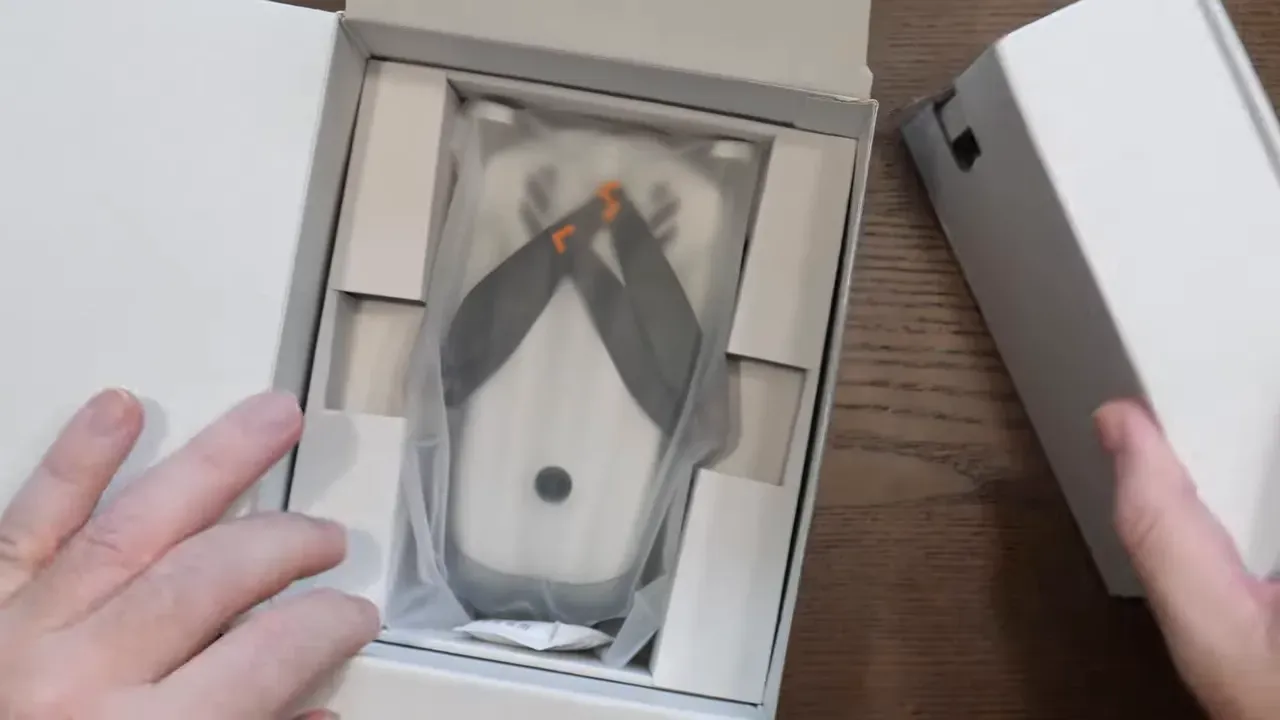 DJI Lito 1 drone neatly packed in the box as hands open the tray