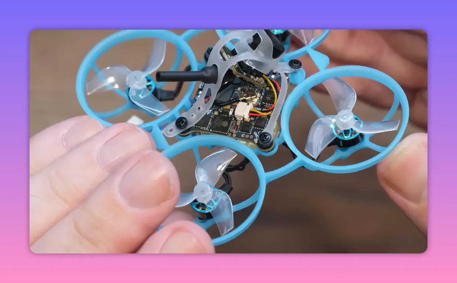 BetaFPV Air65 II freestyle whoop close view showing 5-in-1 electronics stack and antenna wiring