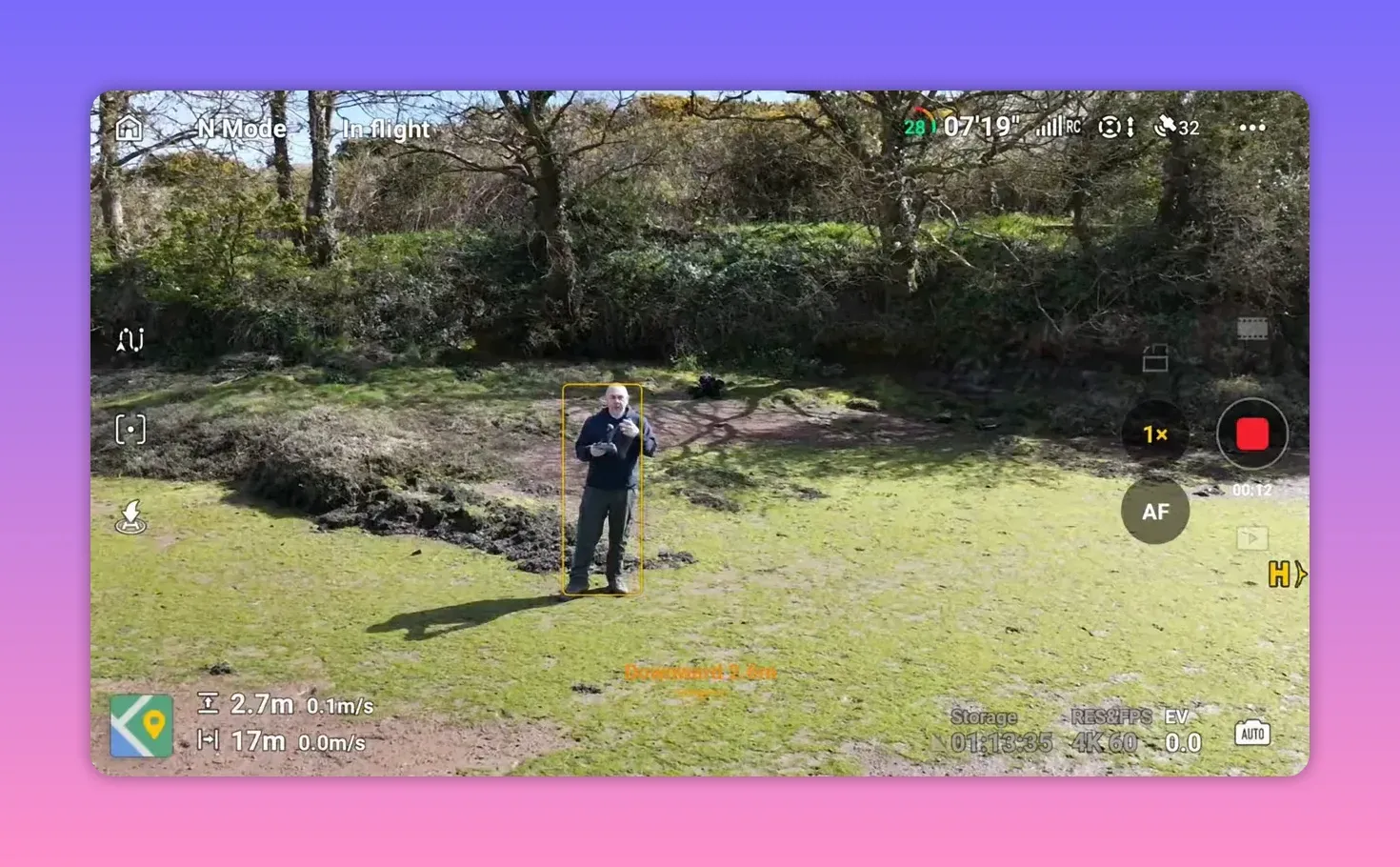 DJI RC2 controller live view in N Mode showing Spotlight subject box around a walking person in a garden