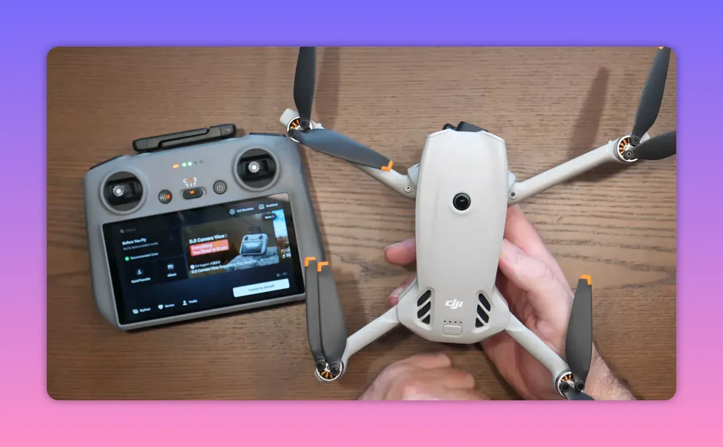 DJI Lito X1 drone front view beside DJI RC2 controller on a wooden table