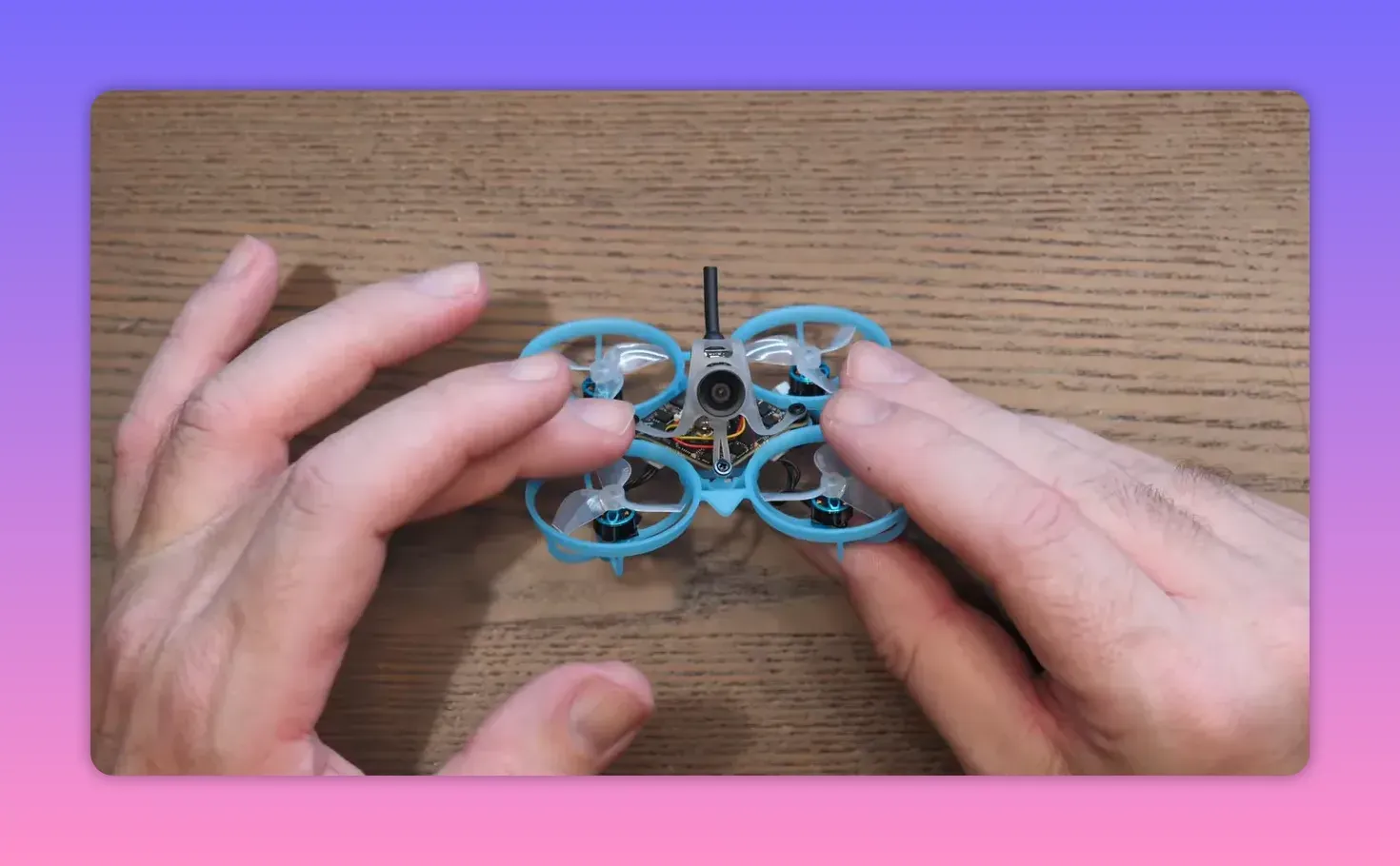 BetaFPV Air65 II freestyle whoop front view held in hands showing the camera and flight electronics layout