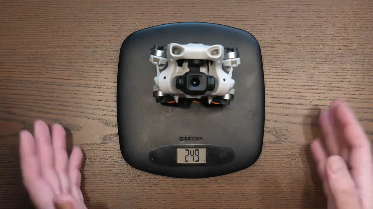 DJI Lito 1 drone resting on a digital scale on a wooden table with the display showing weight reading