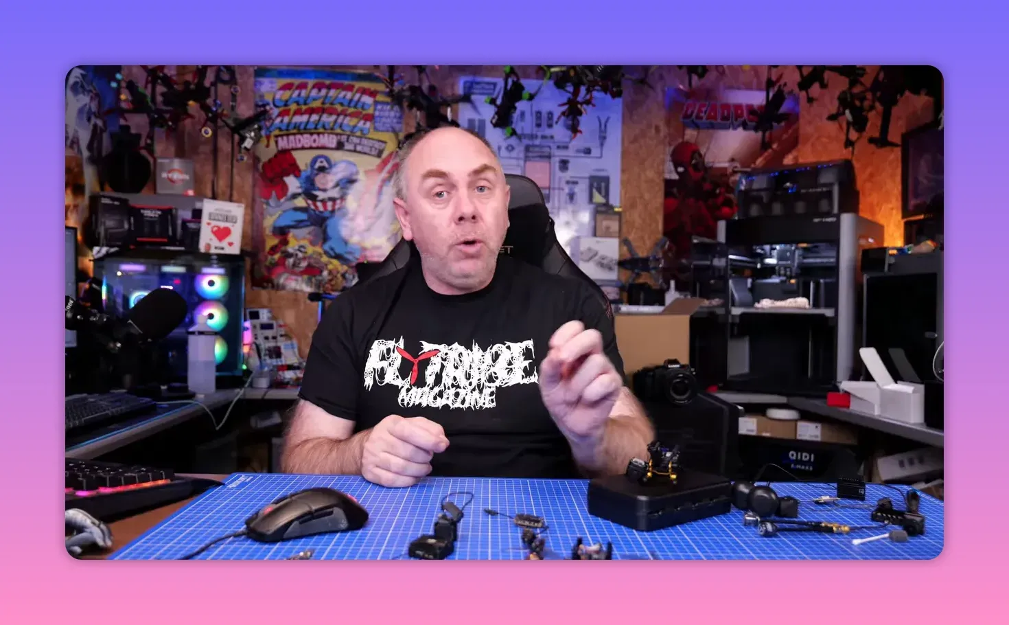 Presenter gesturing while explaining the most likely explanation for DJI O4 Pro gyro issues in a workshop
