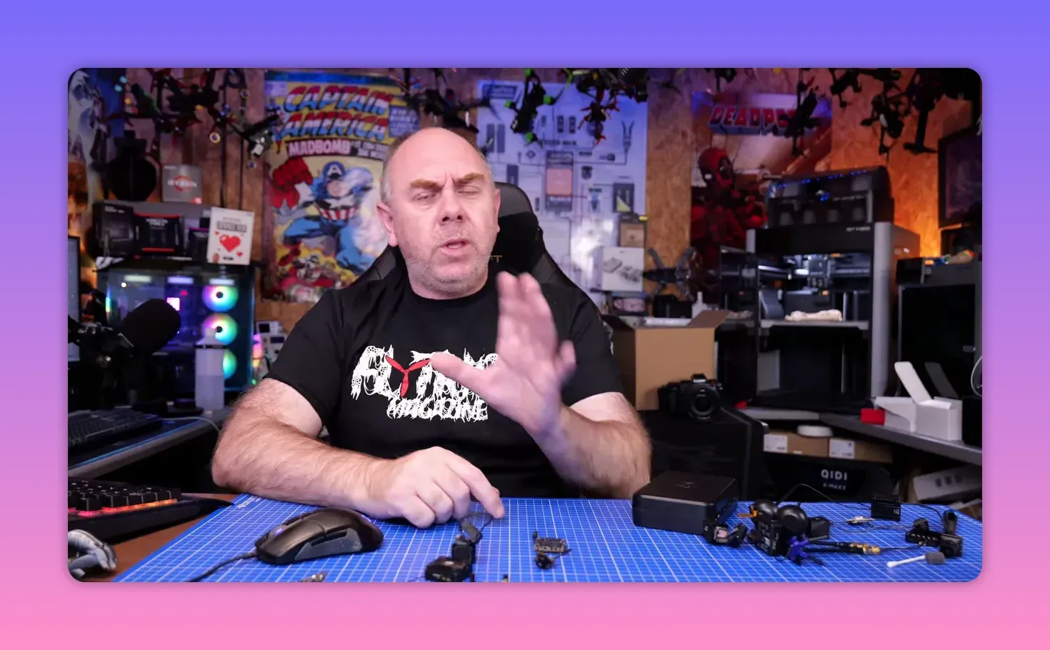 Presenter in a workshop gesturing while discussing whether every 2026 DJI O4 Pro unit is affected by the gyro issue