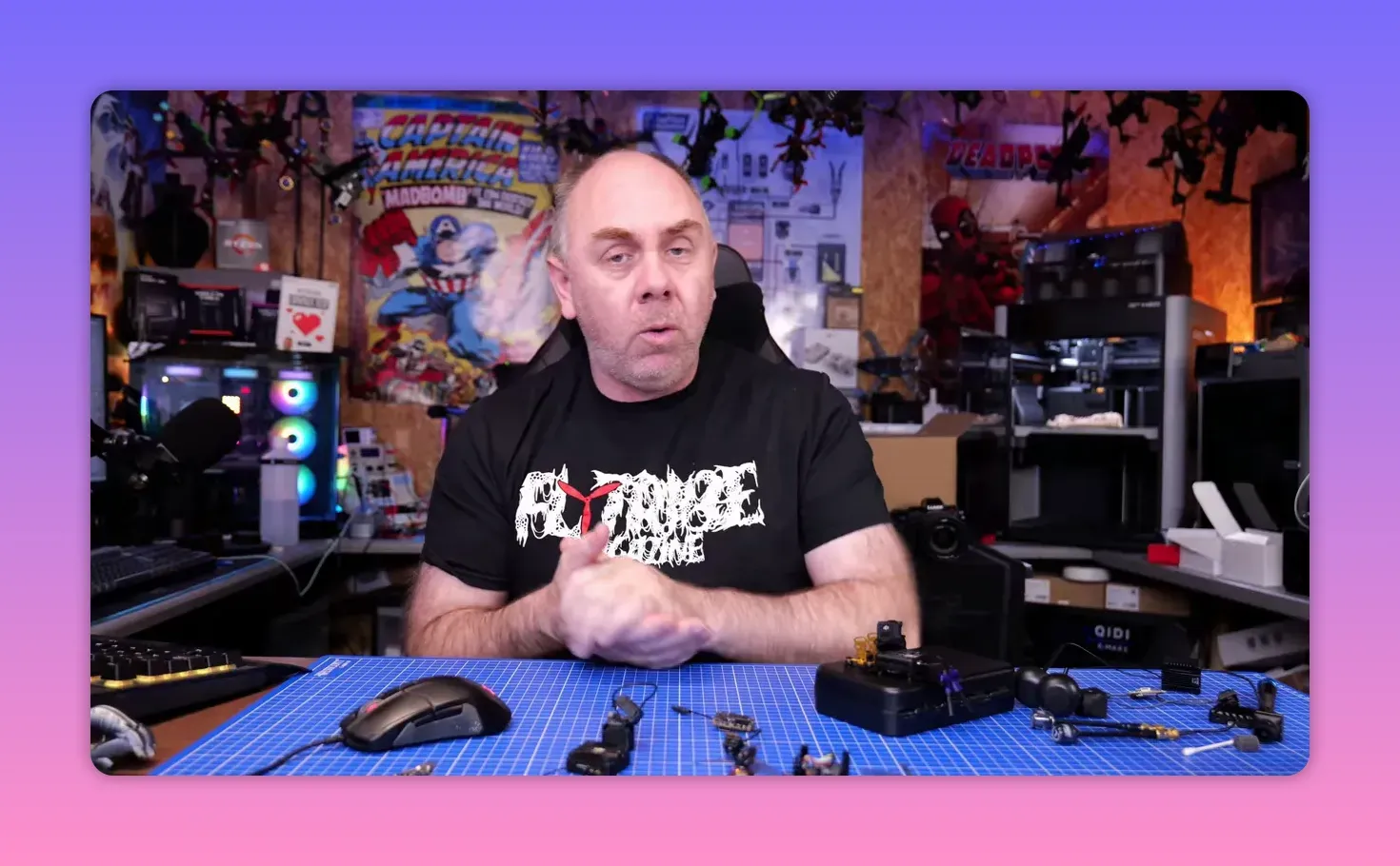 Presenter speaking on the DJI O4 Pro gyro issue with drone gear on the table