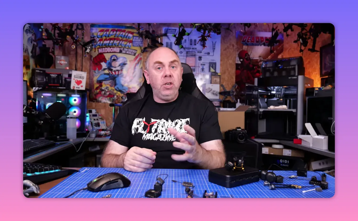 Presenter gesturing while explaining the likely explanation for the DJI O4 Pro gyro issue in a workshop