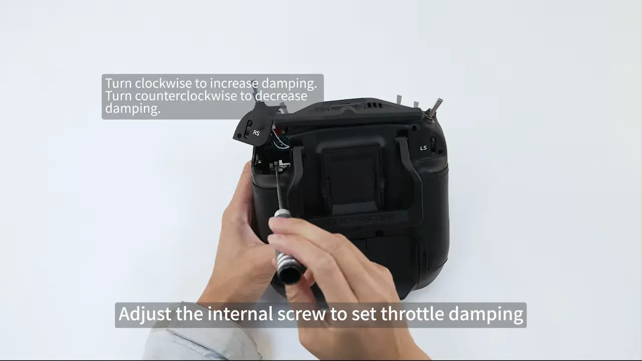 Back of the TX16S MK3 with shoulder module removed and internal damping adjustment note visible