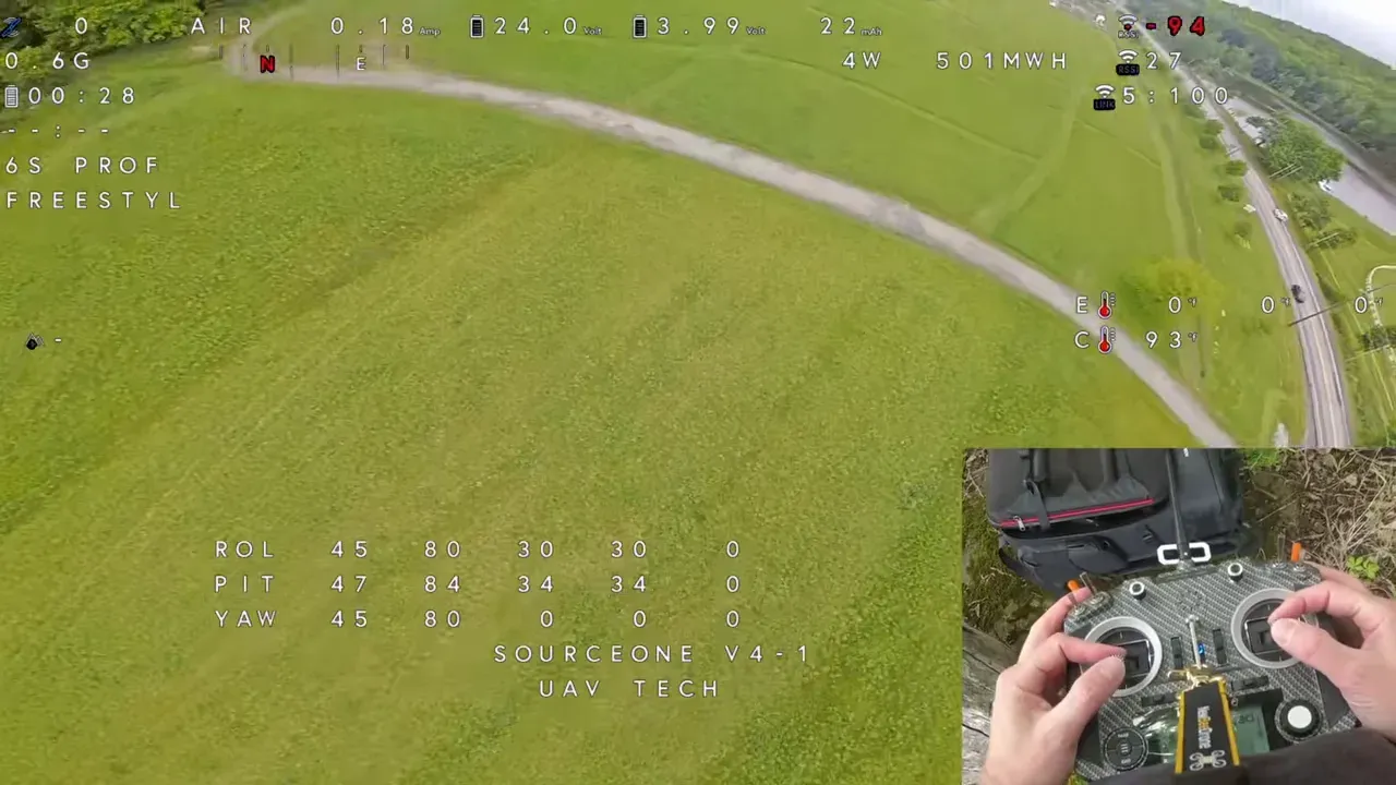 FPV flight OSD with Betaflight Autotune chirp overlay and controller hands inset