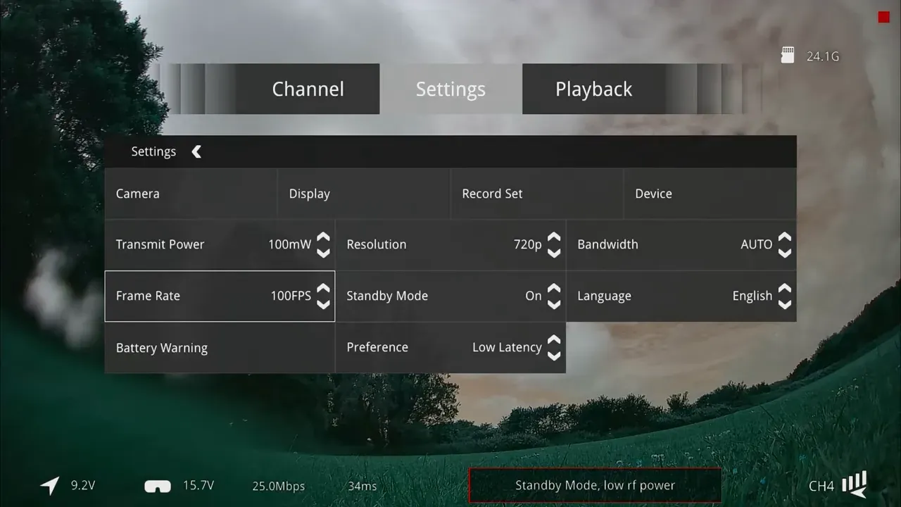 FPV on screen settings menu over a distorted green and pink tinted camera image