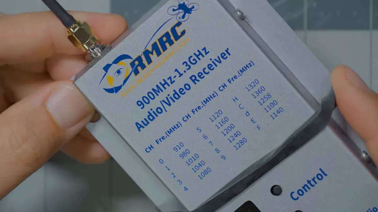 close-up of a small filter module with printed label held in a hand