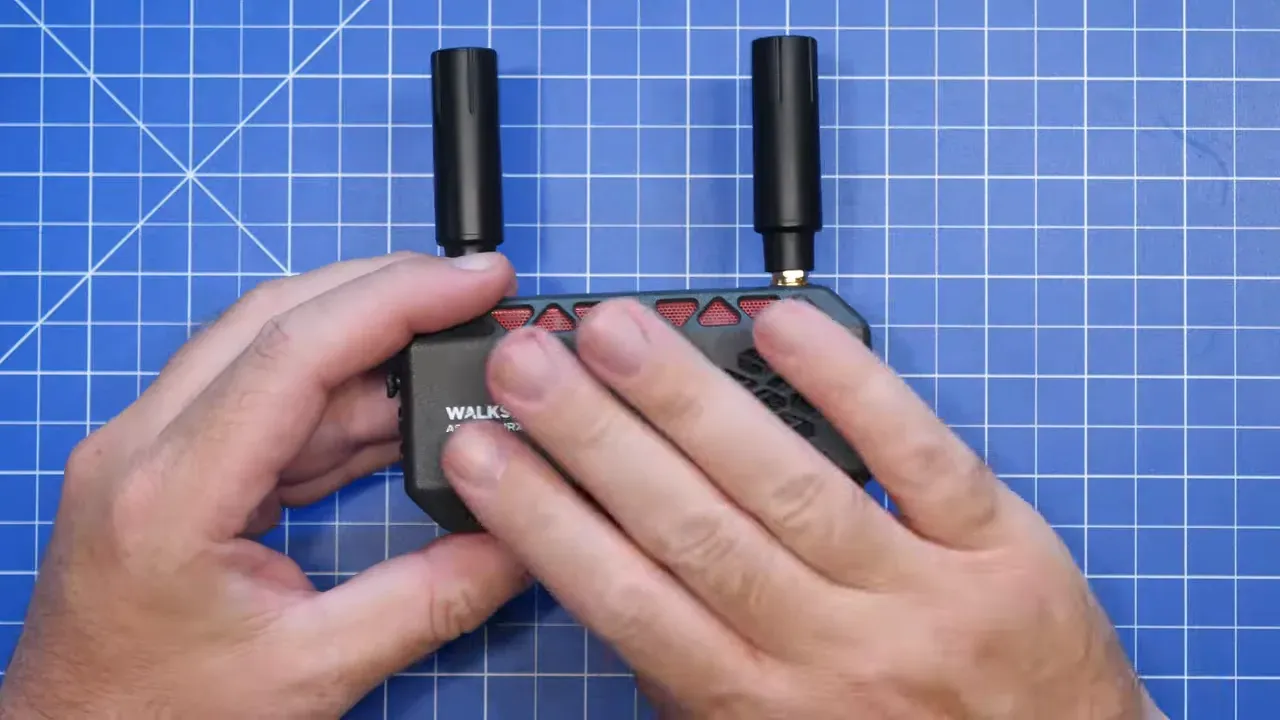 Caddx Ascent VRX Pro with two upright antennas on a cutting mat