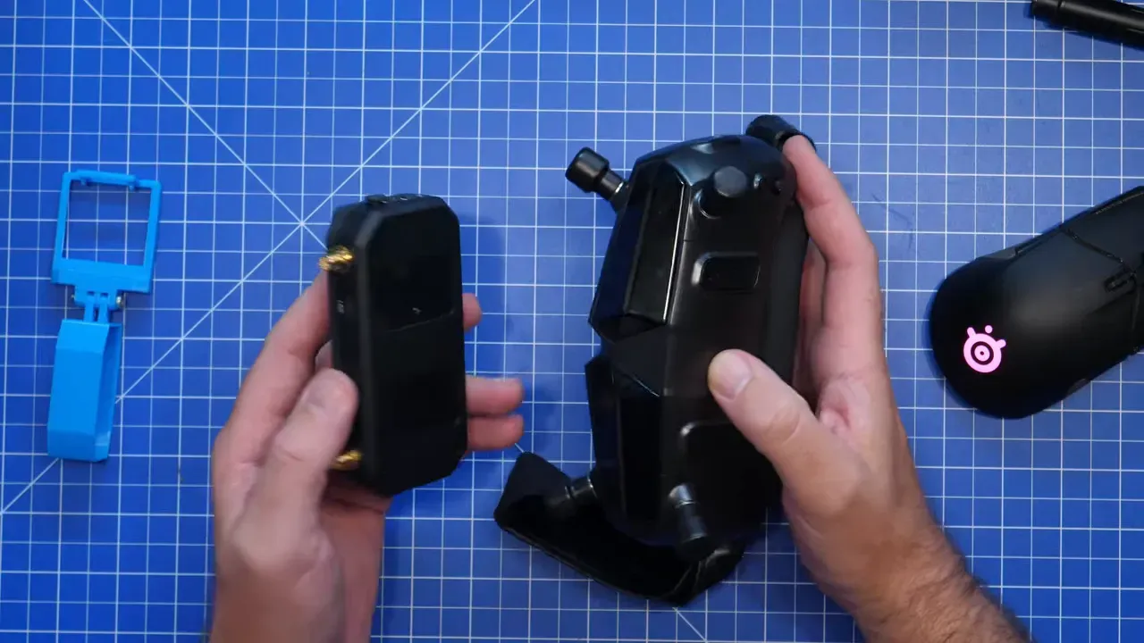 Caddx Ascent VRX Pro held beside FPV goggles and a blue printed mount