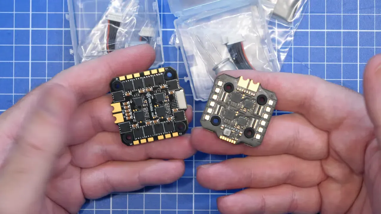 Two Voltara ESC boards held side by side above a blue cutting mat